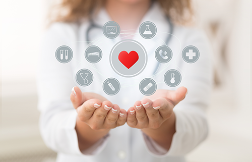 Nurse with her hands open and an abstract collection of icons floating above her hands