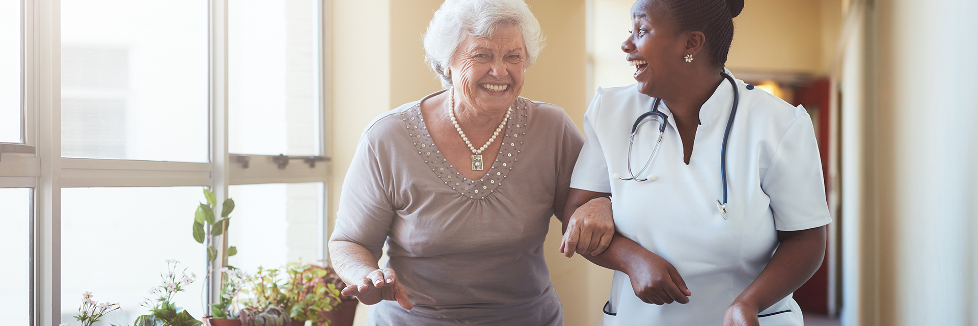 Nurse and Patient walking and laughing